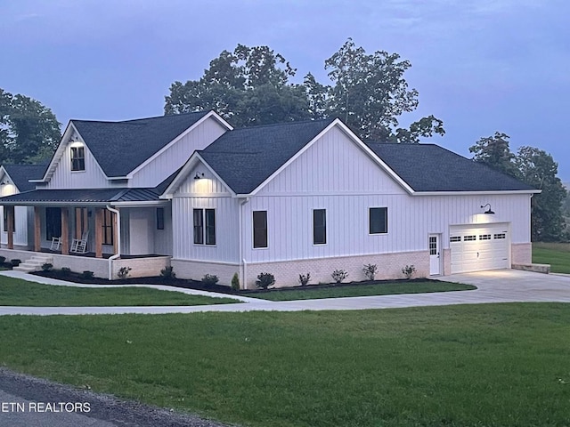 320 Ridge Ln, Monterey, TN 38574 - modern farmhouse with a standing seam roof, a front lawn, covered porch, and board and batten siding