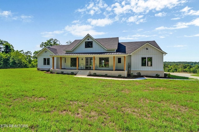 320 Ridge Ln, Monterey, TN 38574 - modern farmhouse style home with board and batten siding, a porch, roof with shingles, a standing seam roof, and a front yard