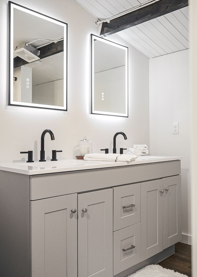 122 Abby Ln, Byrdstown, TN 38549 - full bath featuring double vanity, beam ceiling, and wood finished floors