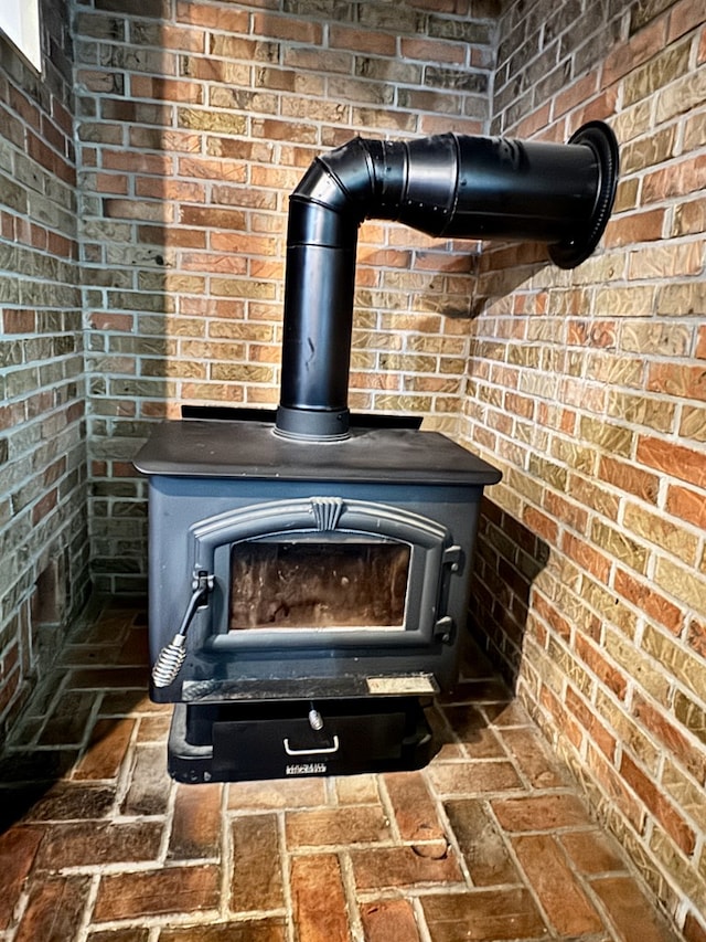 151 Dykes Ln, Crossville, TN 38571 - detailed view of a wood stove and brick wall