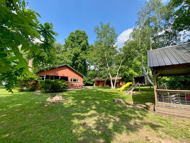 151 Dykes Ln, Crossville, TN 38571 - view of green lawn featuring an outbuilding