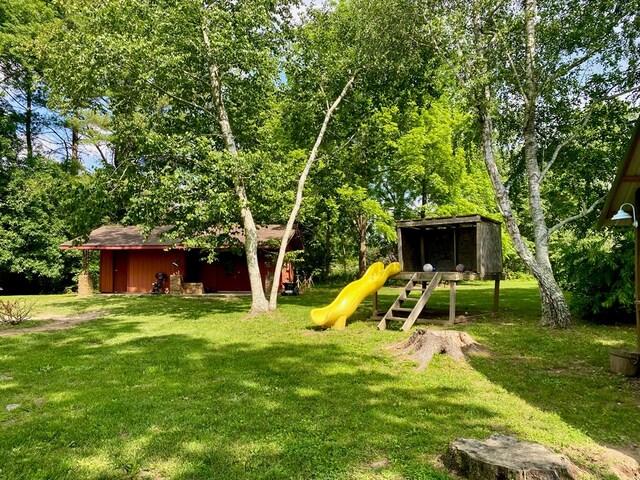 151 Dykes Ln, Crossville, TN 38571 - view of green lawn with a playground and an outbuilding