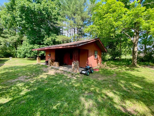151 Dykes Ln, Crossville, TN 38571 - view of pole building featuring a lawn