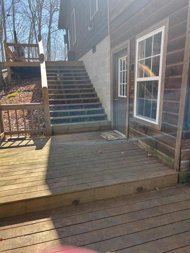 wooden terrace featuring stairs