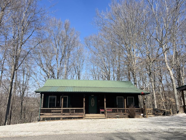 view of front facade with a porch and metal roof