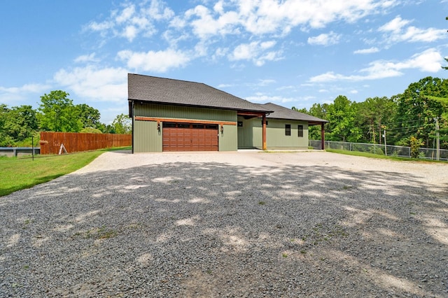2810 Stockton Rd, Jamestown, TN 38556 - view of property exterior with driveway, an attached garage, and roof with shingles