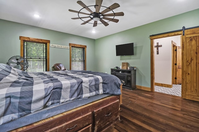 2810 Stockton Rd, Jamestown, TN 38556 - bedroom featuring dark wood-type flooring, a barn door, recessed lighting, and a ceiling fan