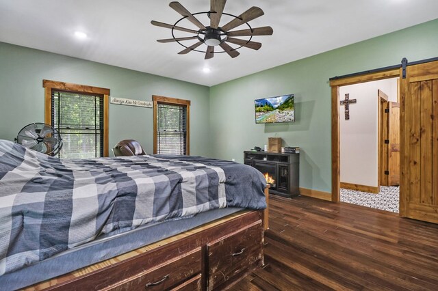 2810 Stockton Rd, Jamestown, TN 38556 - bedroom with dark wood-type flooring, a barn door, recessed lighting, and ceiling fan