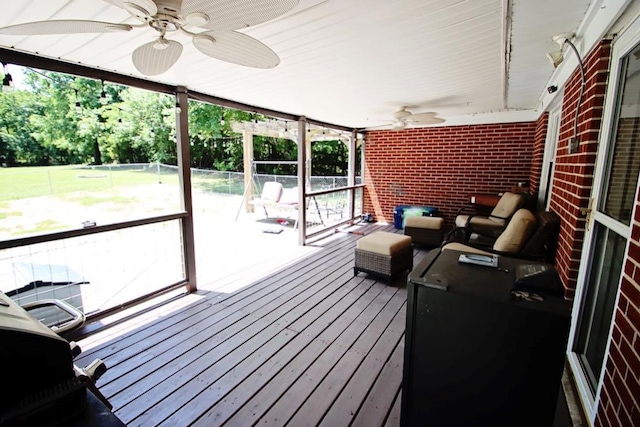 wooden deck featuring a fenced backyard and ceiling fan