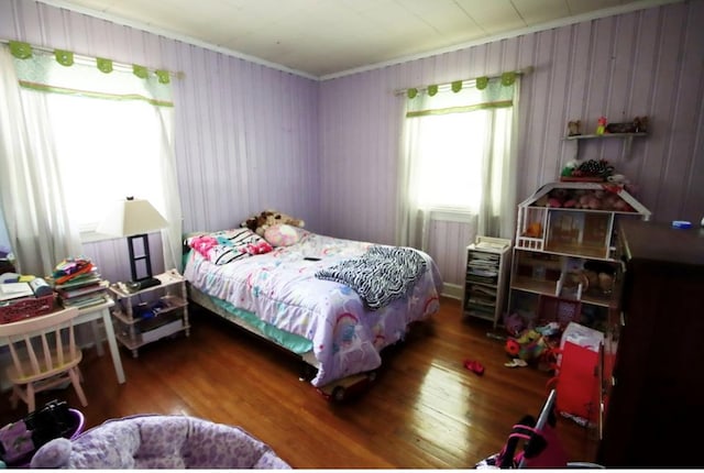 bedroom with wood finished floors