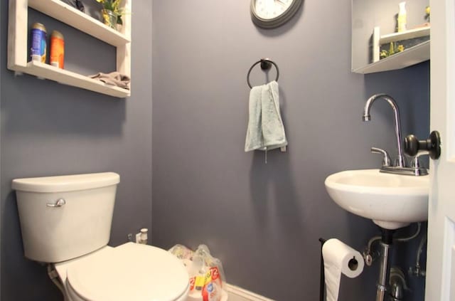 bathroom featuring a sink and toilet