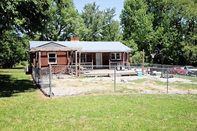 view of front of property featuring brick siding, metal roof, a chimney, and a front lawn