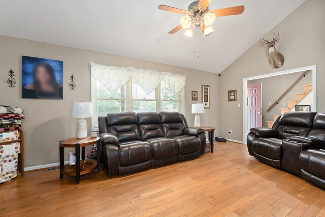 2876 Hilham Hwy, Hilham, TN 38568 - living area featuring light wood-style flooring, stairs, ceiling fan, and lofted ceiling