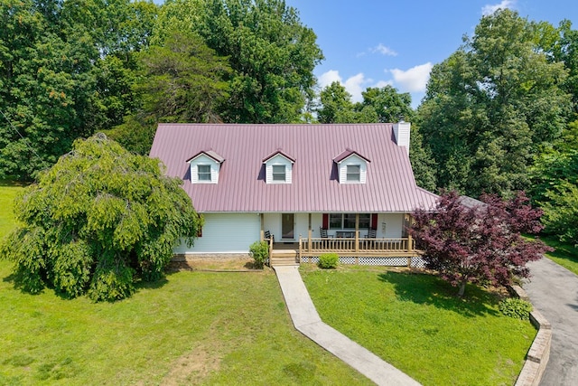 2876 Hilham Hwy, Hilham, TN 38568 - new england style home featuring covered porch, a front yard, a chimney, and a metal roof
