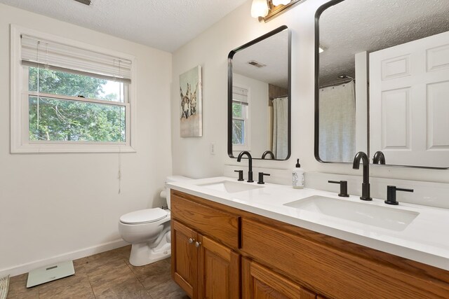 2876 Hilham Hwy, Hilham, TN 38568 - full bath featuring double vanity and a textured ceiling