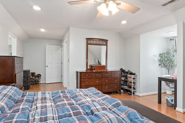 2876 Hilham Hwy, Hilham, TN 38568 - bedroom with wood finished floors, recessed lighting, a ceiling fan, a textured ceiling, and lofted ceiling