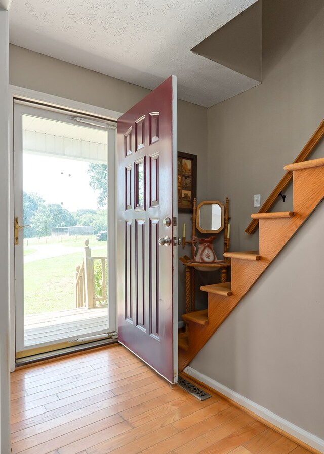 2876 Hilham Hwy, Hilham, TN 38568 - entrance foyer with stairway and wood finished floors