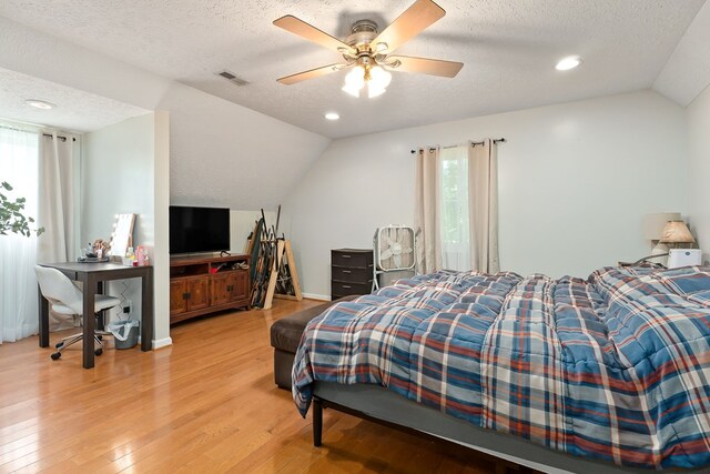2876 Hilham Hwy, Hilham, TN 38568 - bedroom featuring vaulted ceiling, a textured ceiling, light wood-type flooring, ceiling fan, and recessed lighting