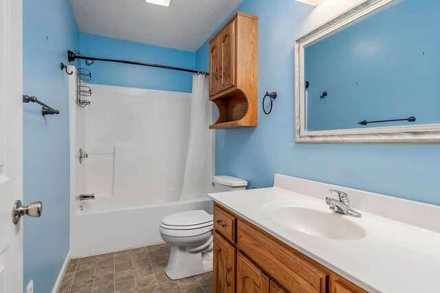 bathroom with toilet, shower / tub combo, and vanity