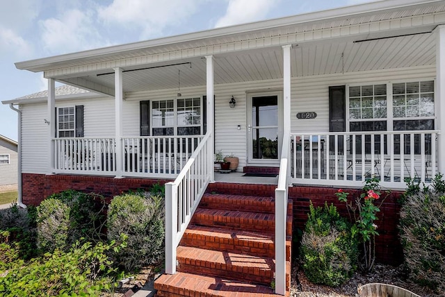 doorway to property with covered porch