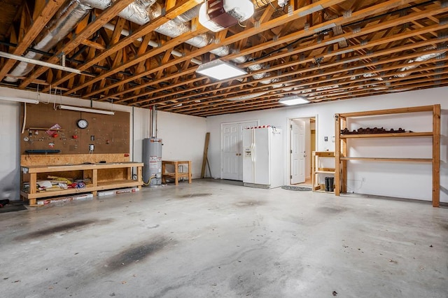 garage with water heater, white refrigerator with ice dispenser, a workshop area, and a garage door opener