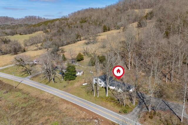 drone / aerial view with a view of trees