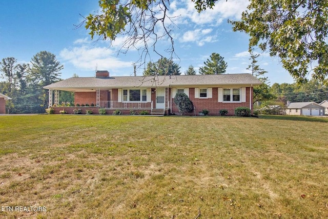 ranch-style house featuring covered porch, a front yard, and brick siding