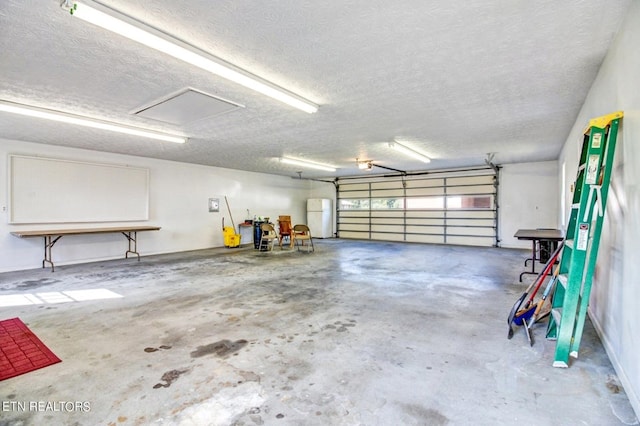 garage featuring freestanding refrigerator