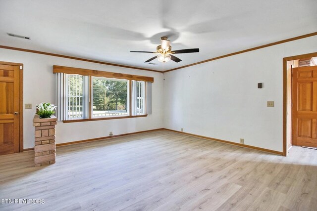 unfurnished living room featuring crown molding, visible vents, and light wood-style floors