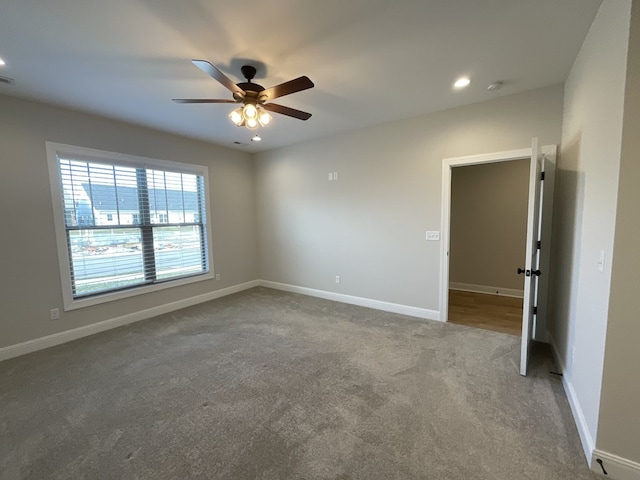 carpeted empty room with recessed lighting, ceiling fan, and baseboards