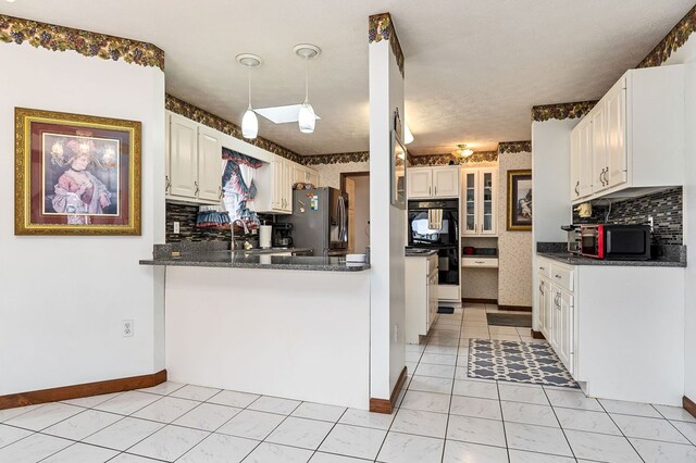 kitchen featuring decorative light fixtures, white cabinets, fridge with ice dispenser, and a peninsula