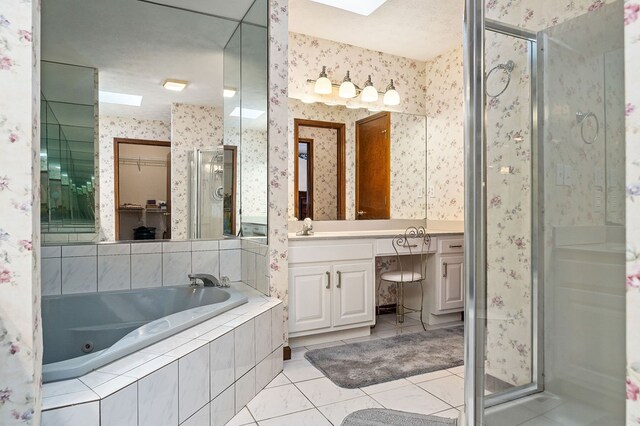 full bath featuring tile patterned floors, a shower stall, vanity, and wallpapered walls