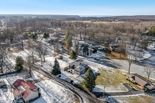 snowy aerial view featuring a residential view