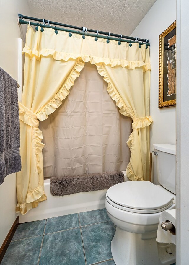 bathroom with toilet, tile patterned flooring, shower / bath combo, and a textured ceiling