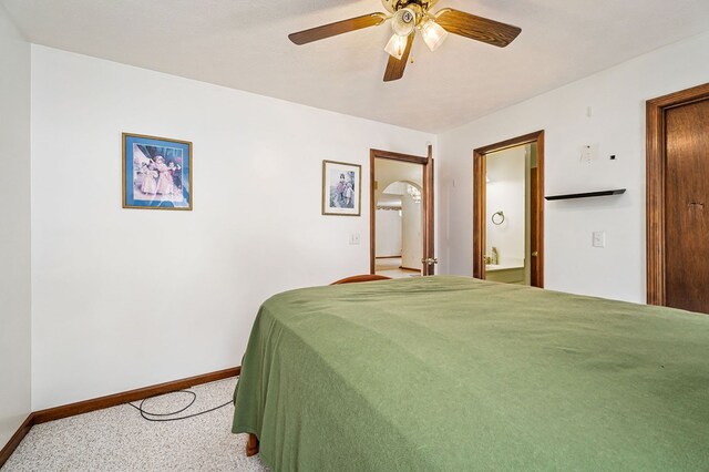 carpeted bedroom featuring ceiling fan and baseboards