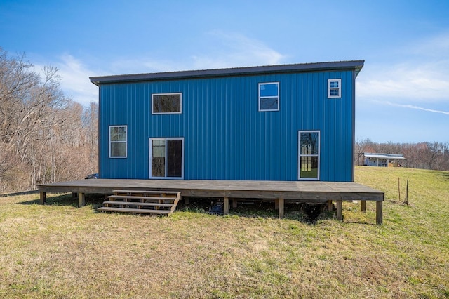 back of house featuring a yard and a deck