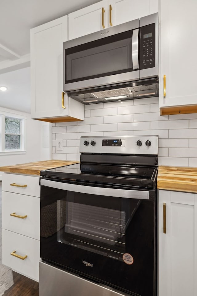 1069 Pleasant Shade Hwy, Pleasant Shade, TN 37145 - kitchen featuring stainless steel appliances, butcher block counters, white cabinets, and backsplash