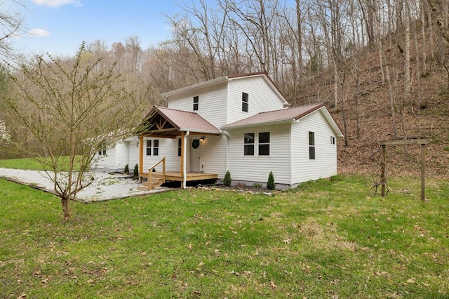 1069 Pleasant Shade Hwy, Pleasant Shade, TN 37145 - view of front facade with a deck, a metal roof, and a front lawn