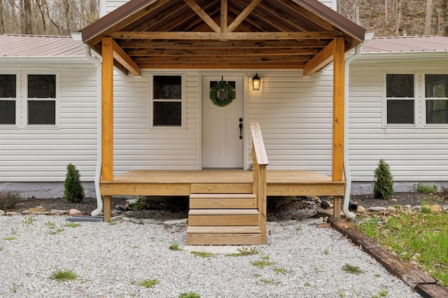 1069 Pleasant Shade Hwy, Pleasant Shade, TN 37145 - view of exterior entry with a wooden deck and a metal roof