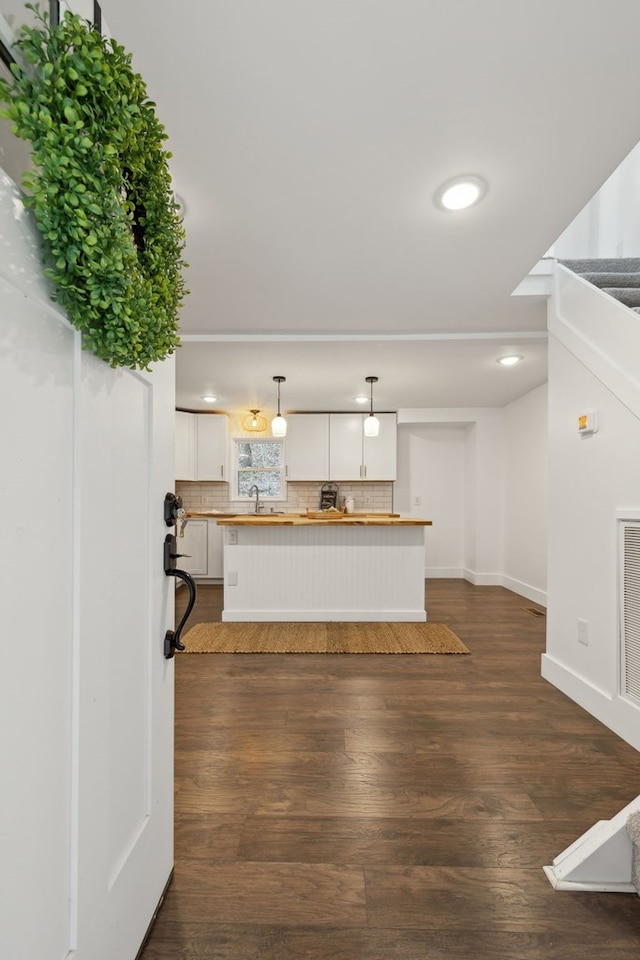 1069 Pleasant Shade Hwy, Pleasant Shade, TN 37145 - kitchen featuring white cabinets, butcher block counters, dark wood finished floors, tasteful backsplash, and recessed lighting