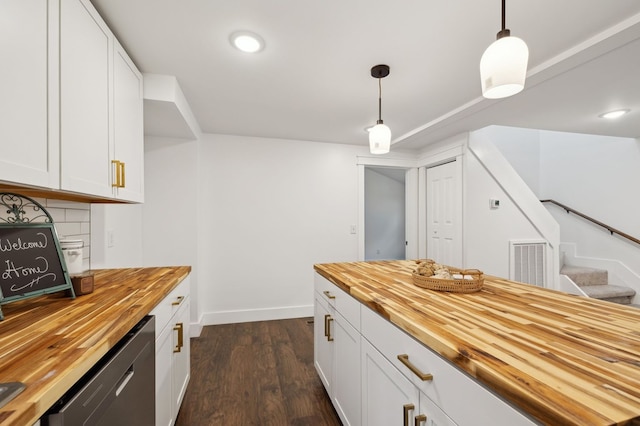 1069 Pleasant Shade Hwy, Pleasant Shade, TN 37145 - kitchen featuring wooden counters, stainless steel dishwasher, dark wood-style floors, hanging light fixtures, and white cabinets