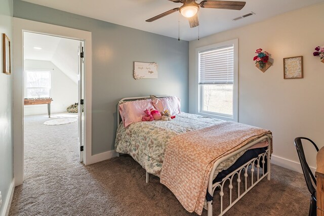 bedroom with visible vents, baseboards, carpet, vaulted ceiling, and a ceiling fan