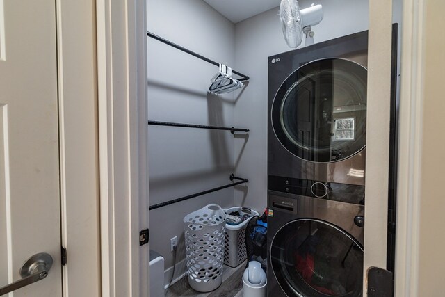 washroom with laundry area and stacked washing maching and dryer