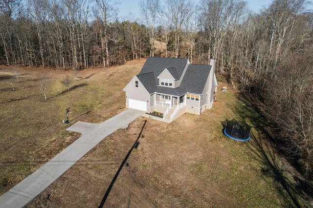 drone / aerial view with a view of trees