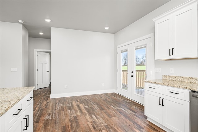 kitchen featuring french doors, recessed lighting, dark wood-type flooring, white cabinetry, and light stone countertops