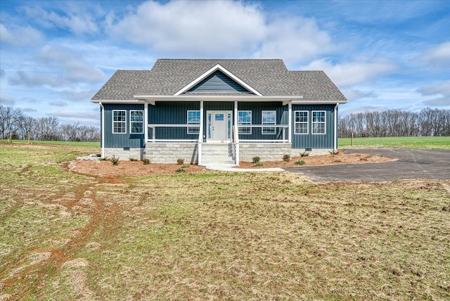 view of front of home with a front lawn and crawl space