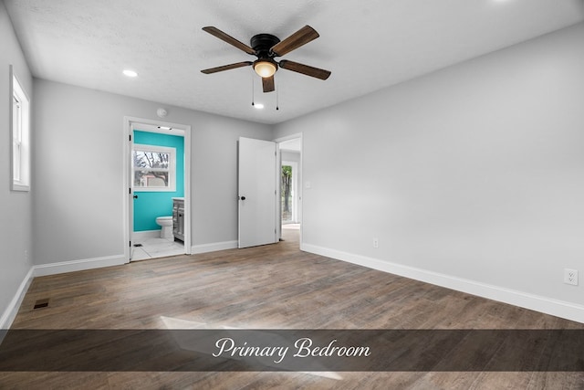 spare room featuring visible vents, baseboards, ceiling fan, wood finished floors, and recessed lighting