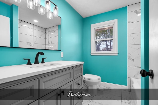 full bathroom featuring toilet, vanity, baseboards, marble finish floor, and shower / bathing tub combination