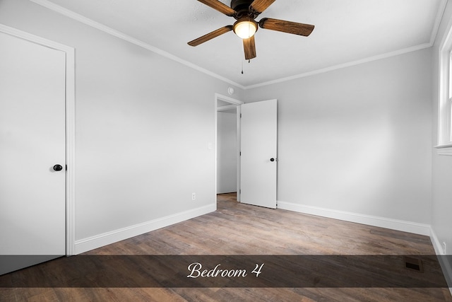 unfurnished room with ceiling fan, visible vents, baseboards, light wood finished floors, and crown molding