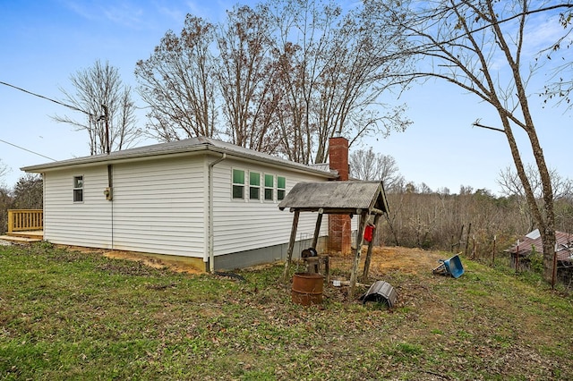 exterior space featuring a chimney